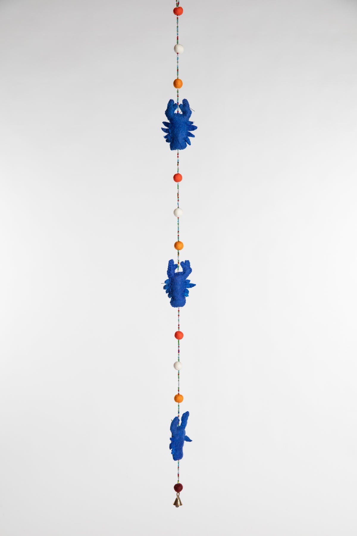 A beaded felt blue lobster garland with felt balls 
