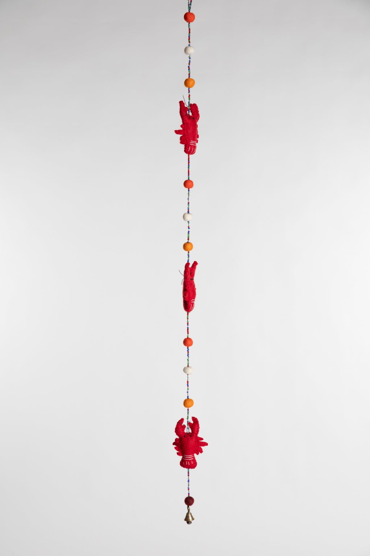 A beaded felt red lobster garland with felt balls 