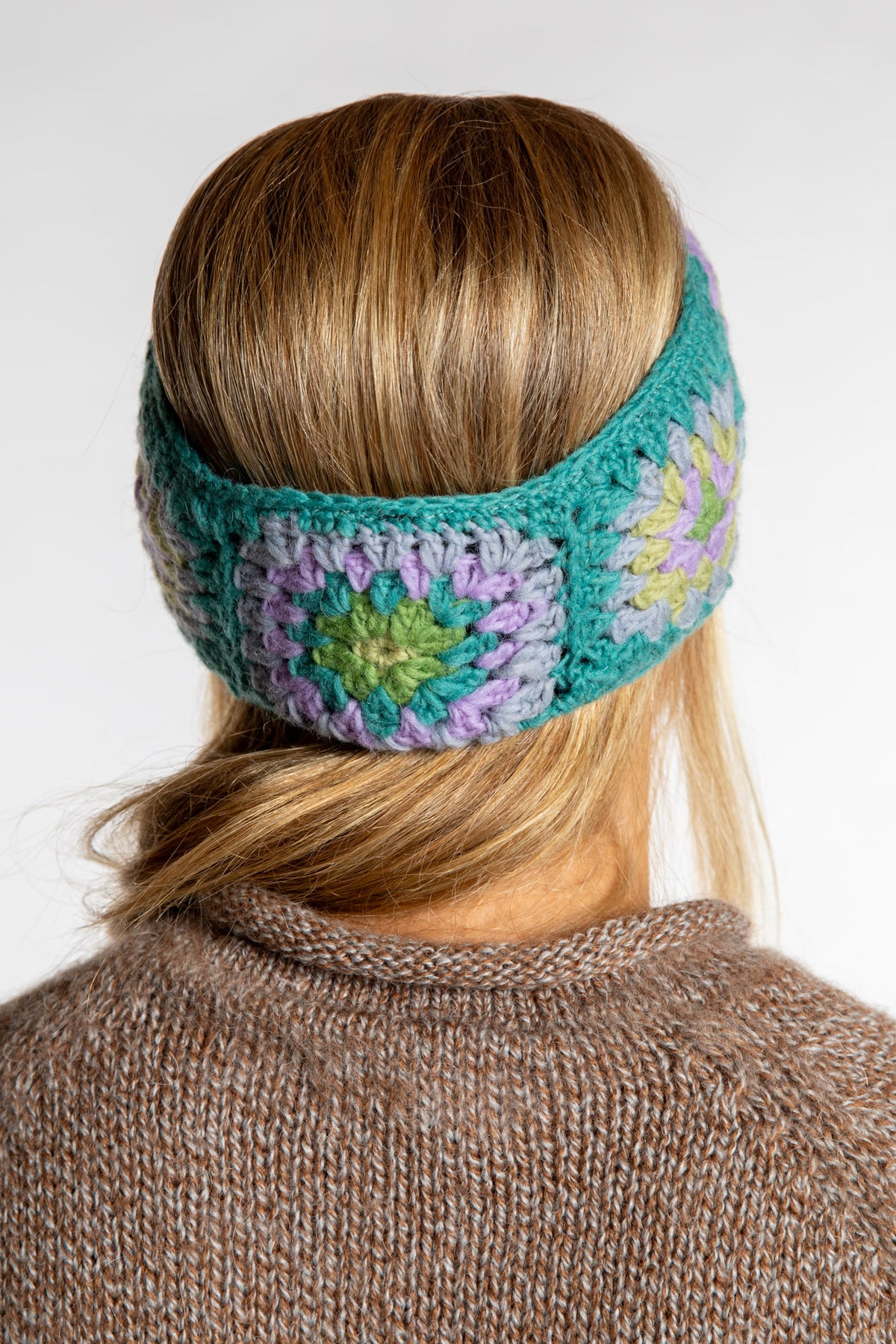 Sophie is wearing the Granny Square Wool Headband in Mint
