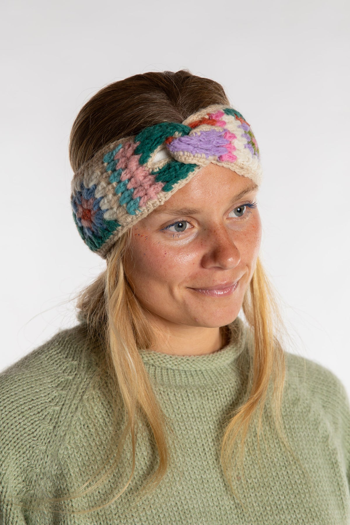 Sophie is wearing the Granny Square Wool Headband in Natural