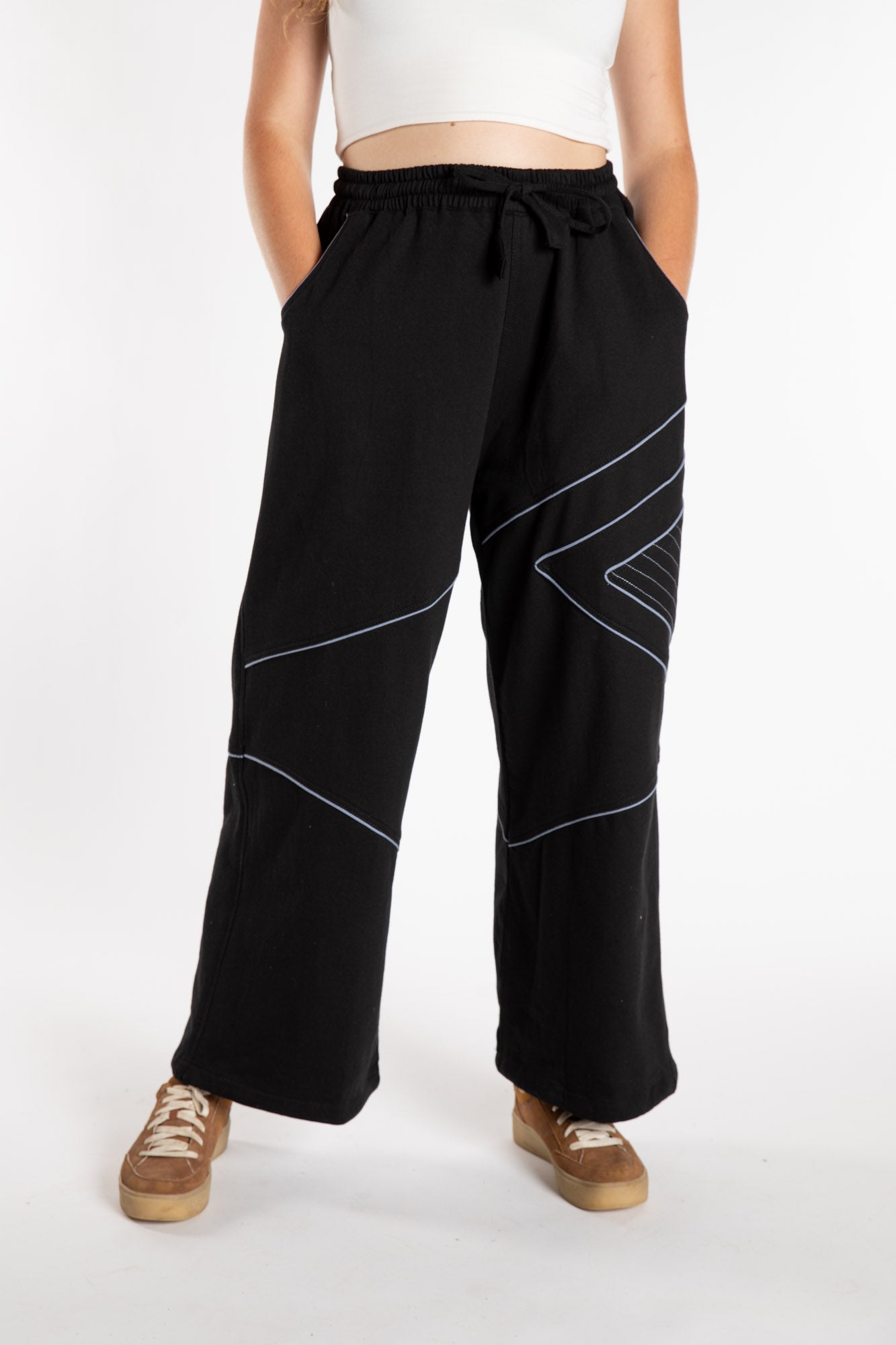Emily is wearing the Black Himal Contrast Stitch Sweatpants in S/M