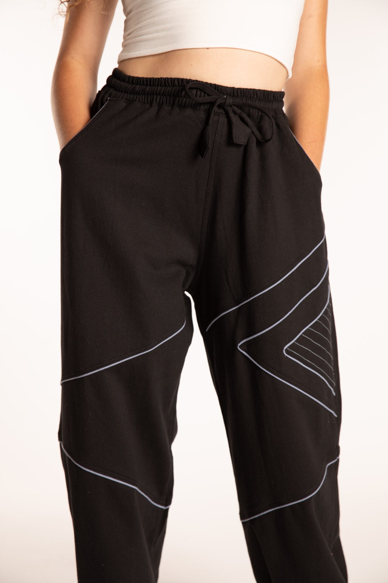 Emily is wearing the Black Himal Contrast Stitch Sweatpants in S/M