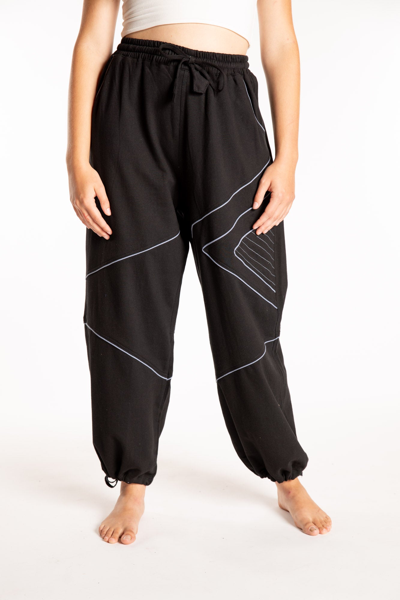 Emily is wearing the Black Himal Contrast Stitch Sweatpants in S/M