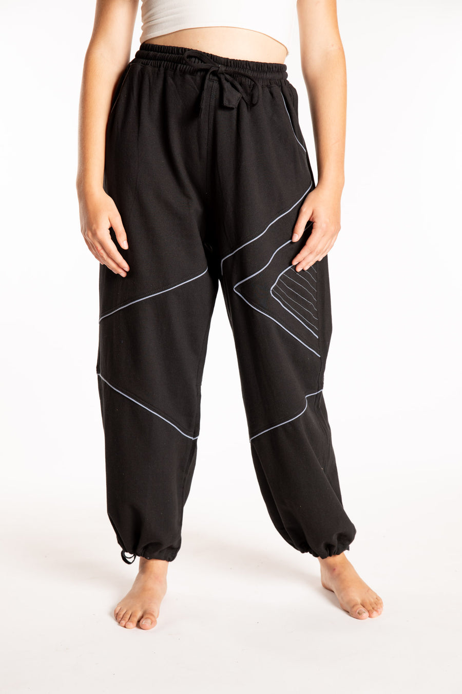 Emily is wearing the Black Himal Contrast Stitch Sweatpants in S/M