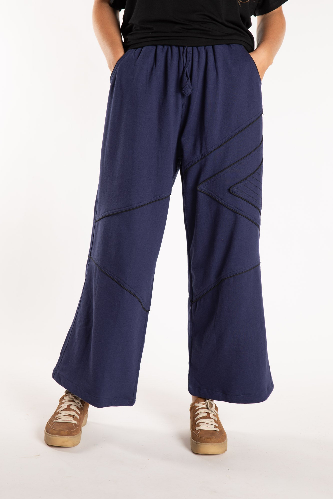 Emily is wearing the Navy Himal Contrast Stitch Sweatpants in S/M