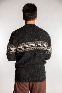 Topher is wearing the Large Himalayan Patterned Wool Sweater in Charcoal Wave