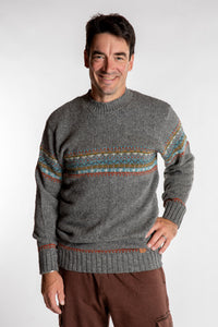 Topher is wearing the Large Himalayan Patterned Wool Sweater in Natural Multi
