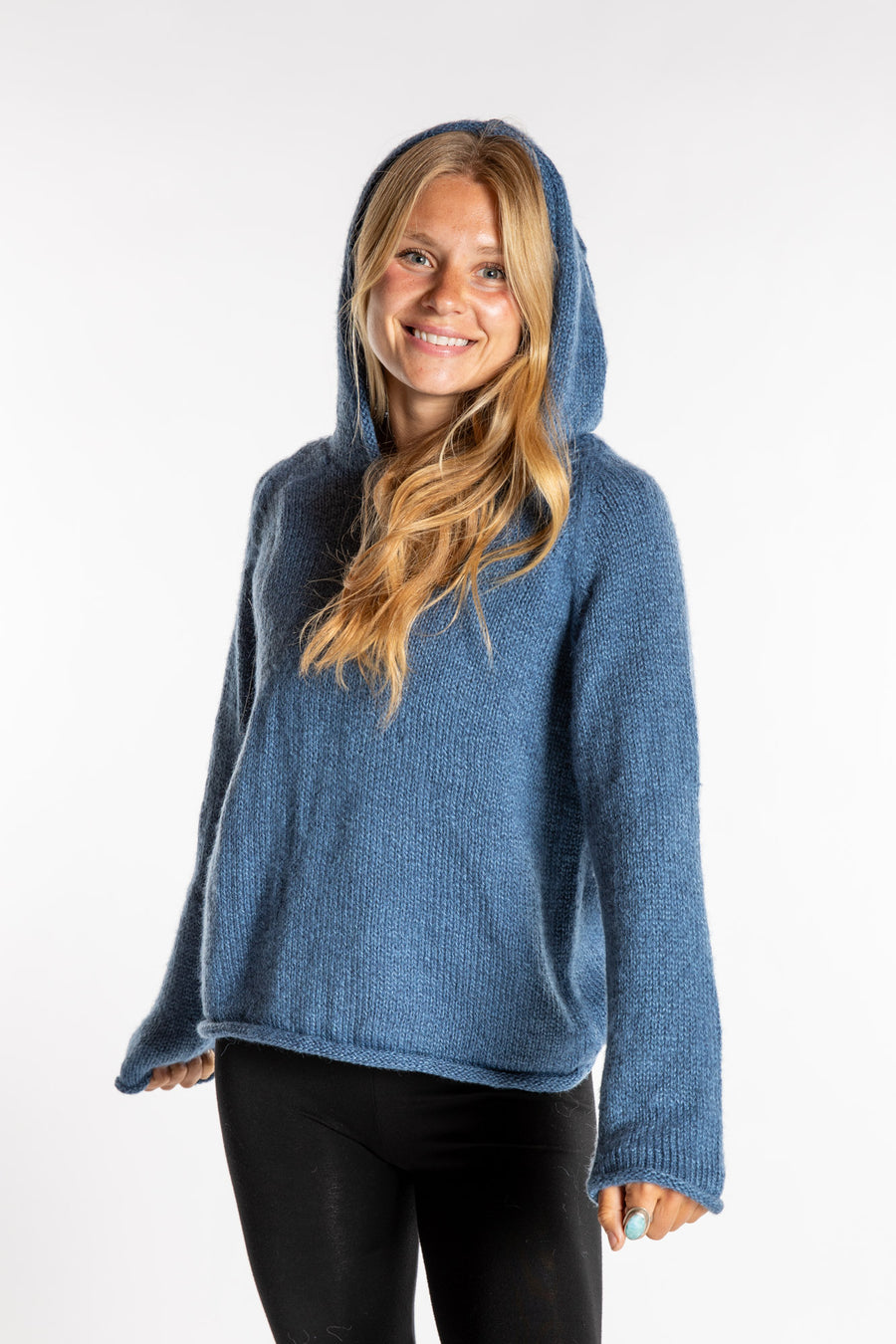 Sophie is wearing a small light blue Hooded Alpaca Sweater
