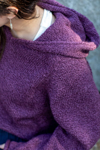Morgaine is wearing size M alpaca hoodie in plum