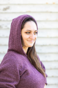 Morgaine is wearing size M alpaca hoodie in plum
