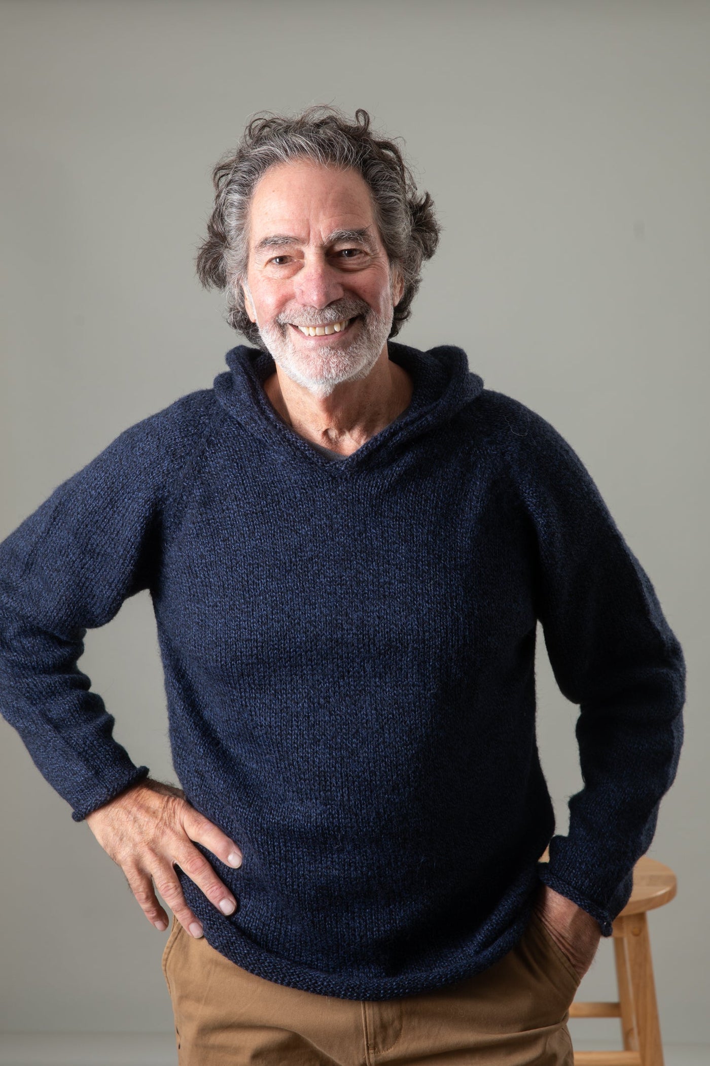 Bernie is wearing size L alpaca hoodie in navy