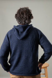 Bernie is wearing size L alpaca hoodie in navy