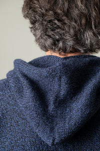 Bernie is wearing size L alpaca hoodie in navy