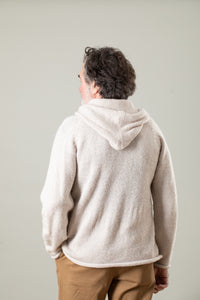 Bernie is wearing size L alpaca hoodie in oatmeal