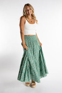 Sophie is wearing the one size Indira Printed Prairie Skirt in Aquamarine