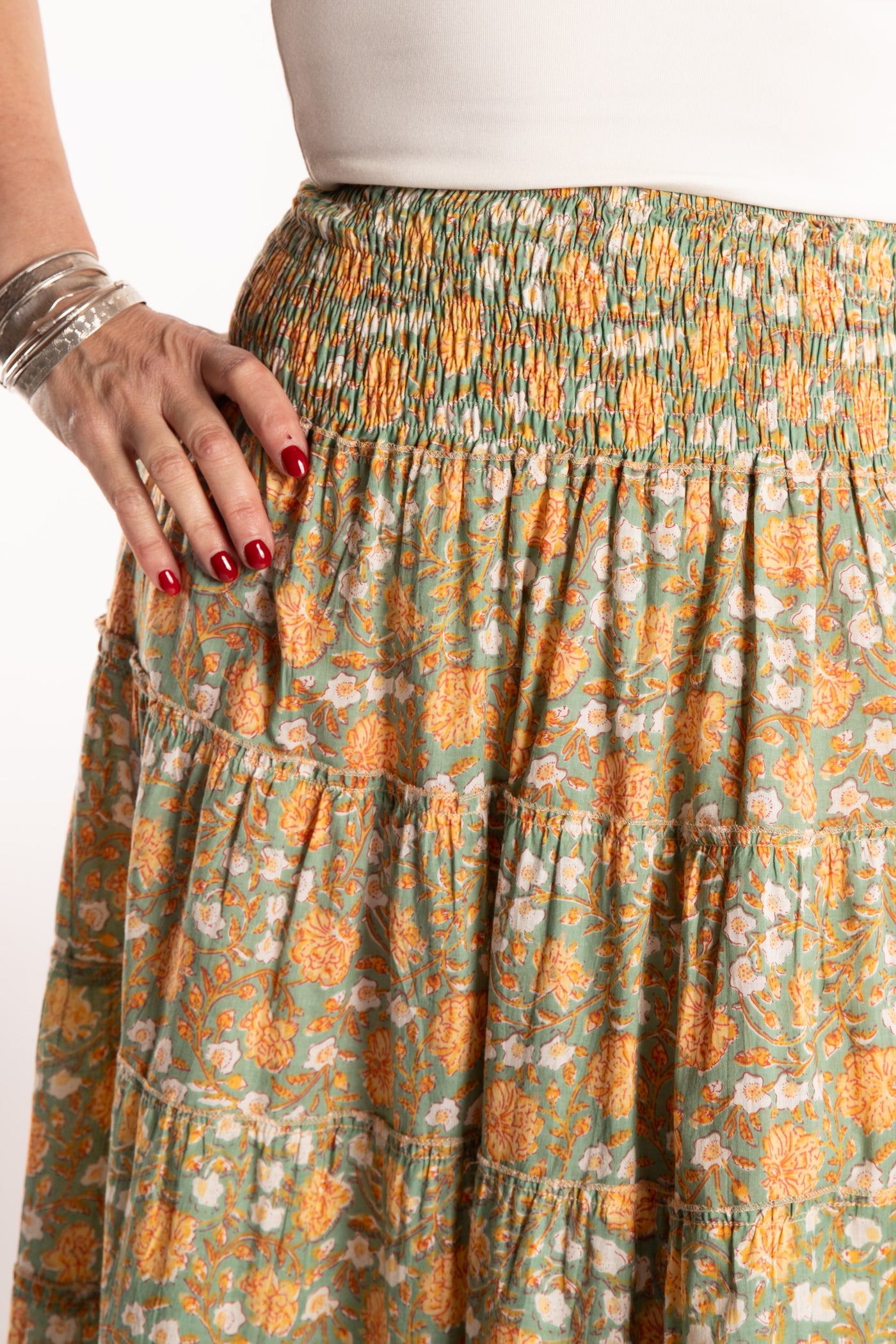 Susan is wearing the one size Indira Printed Prairie Skirt in Jade