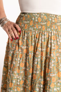 Susan is wearing the one size Indira Printed Prairie Skirt in Jade