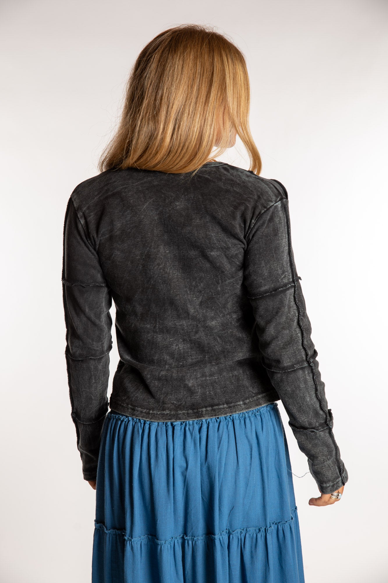 Sophie is wearing the Black Isha Seamed Mosaic Top in size small