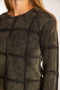 Sophie is wearing the Green Isha Seamed Mosaic Top in size small