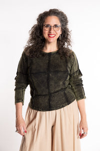 Susan is wearing the M/L Isha Seamed Mosaic Top in Green