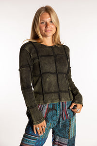 Sophie is wearing the Green Isha Seamed Mosaic Top in size small