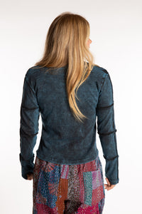 Sophie is wearing the Teal Isha Seamed Mosaic Top in size small