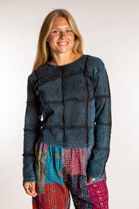 Sophie is wearing the Teal Isha Seamed Mosaic Top in size small