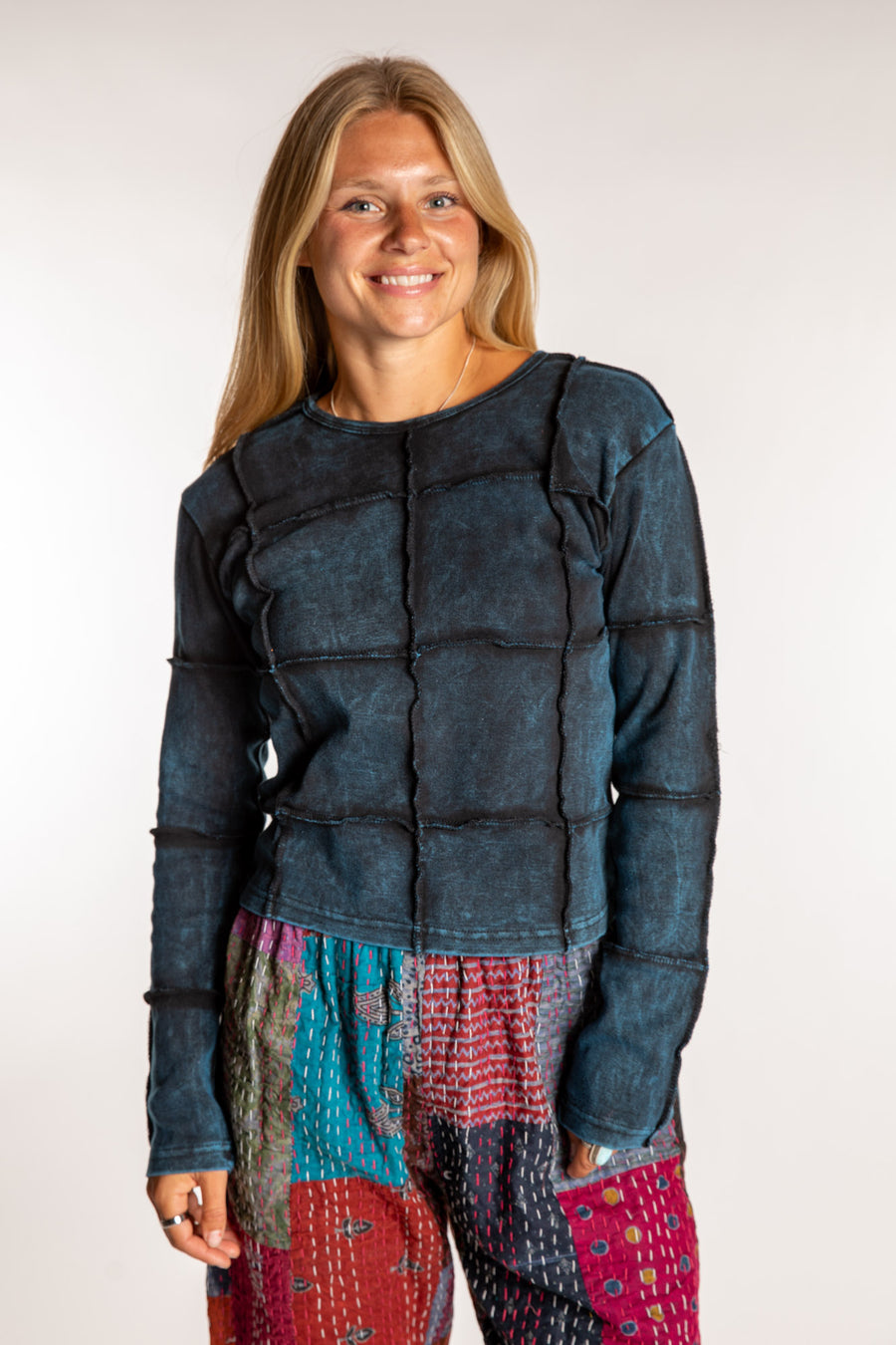 Sophie is wearing the Teal Isha Seamed Mosaic Top in size small