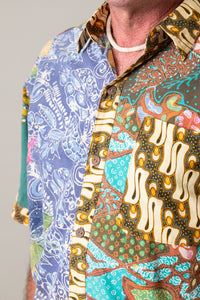 Ross is wearing the size L Patchwork button down shirt