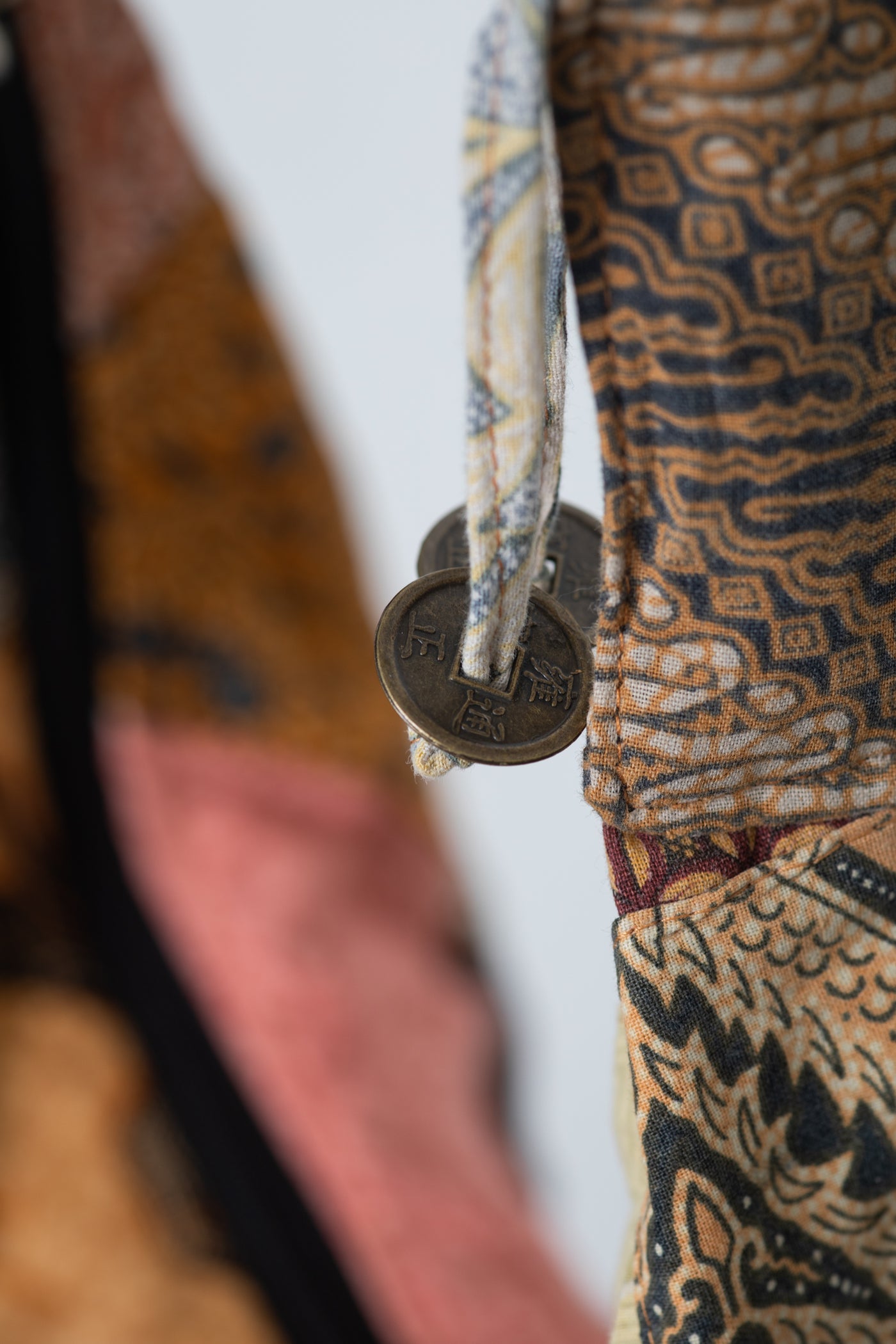 Assorted colorful patterned java patch moon bag detail of coins