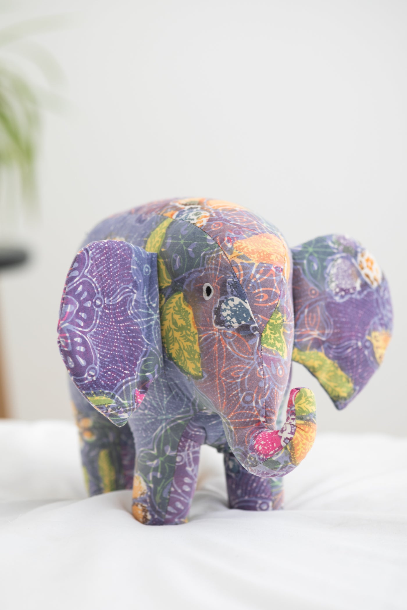 Assorted multicolor elephant plush toy with floral patterns