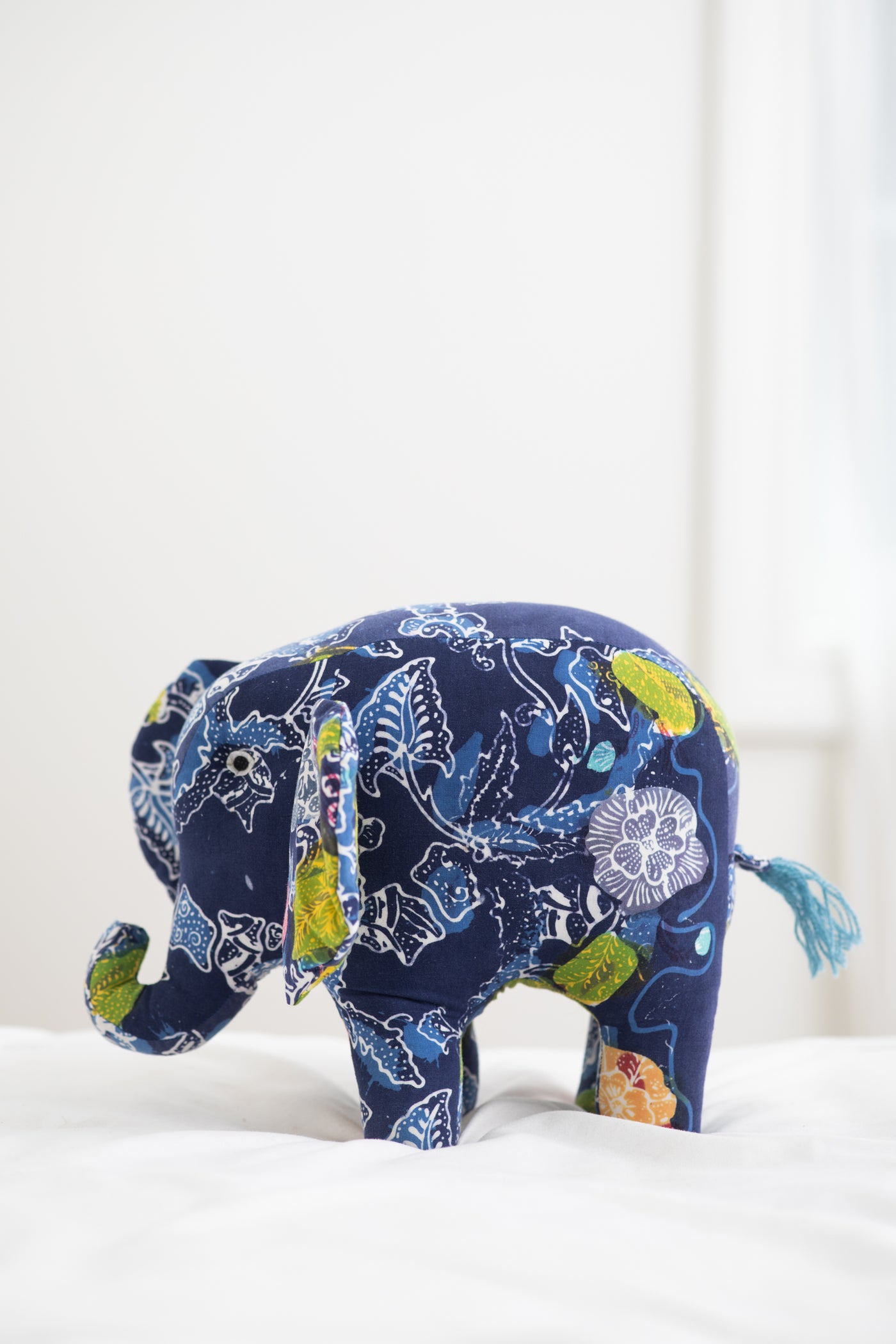 Assorted multicolor elephant plush toy with floral patterns