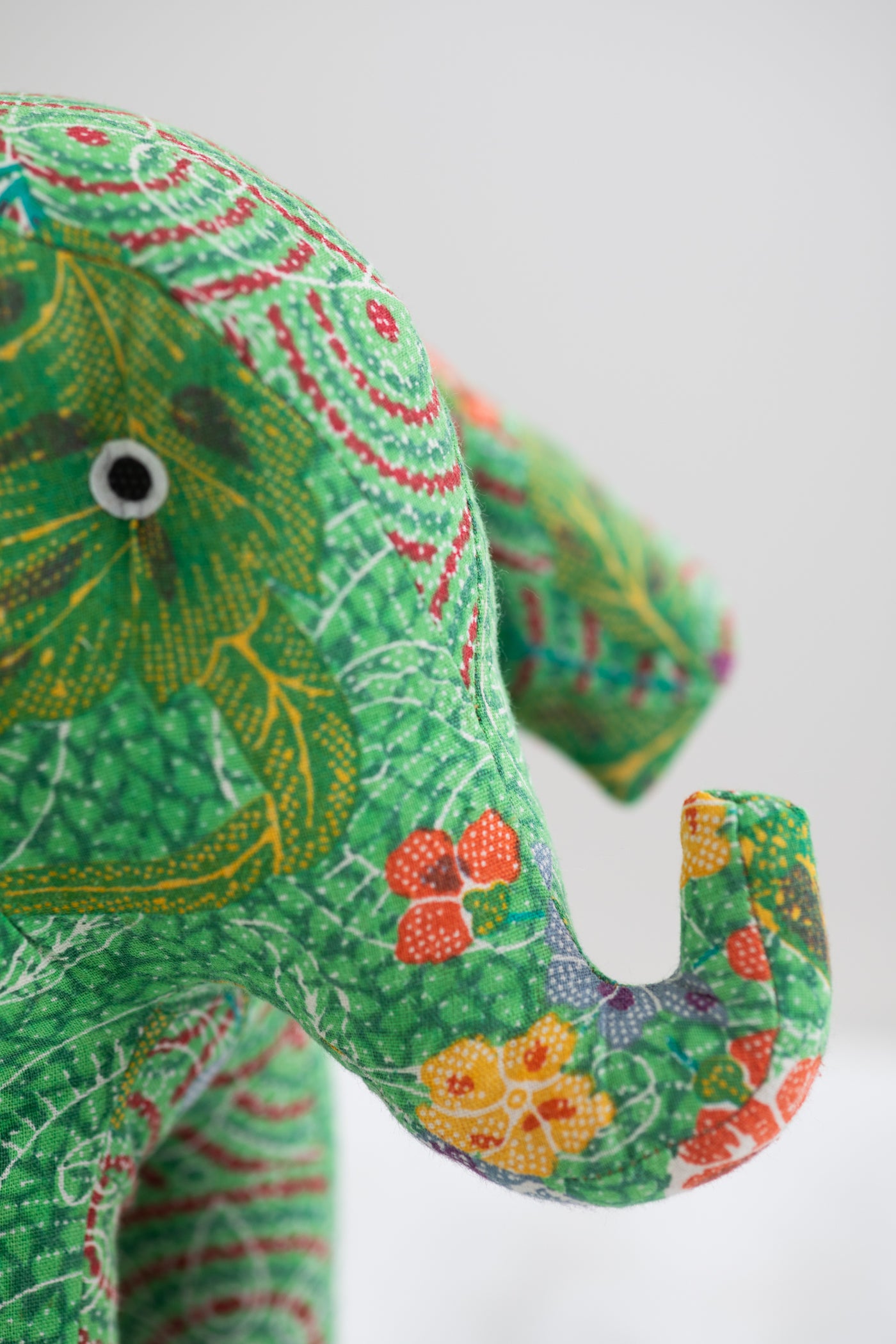 Assorted multicolor elephant plush toy with floral patterns