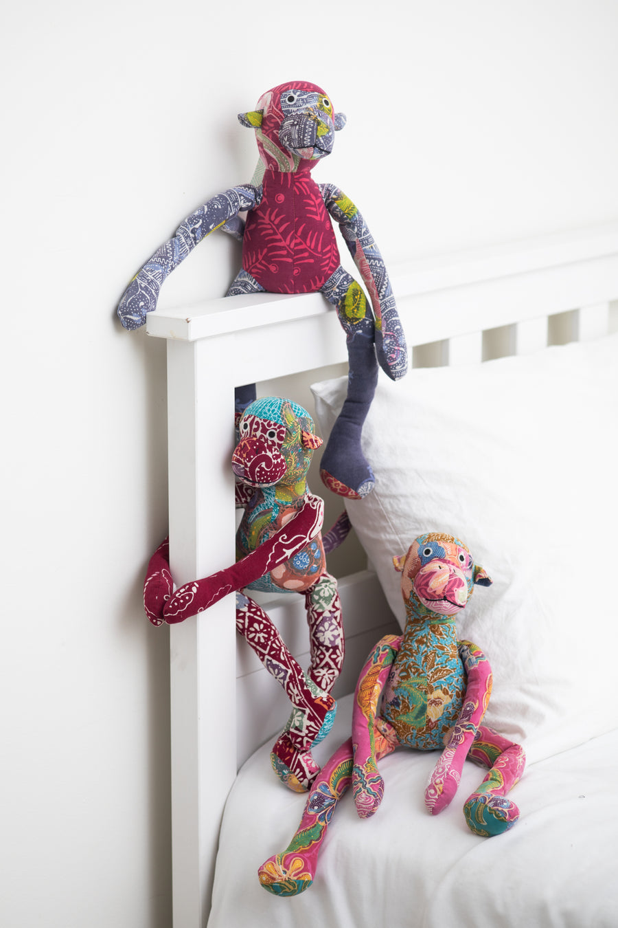 Assorted multicolor patchwork stuffed monkeys