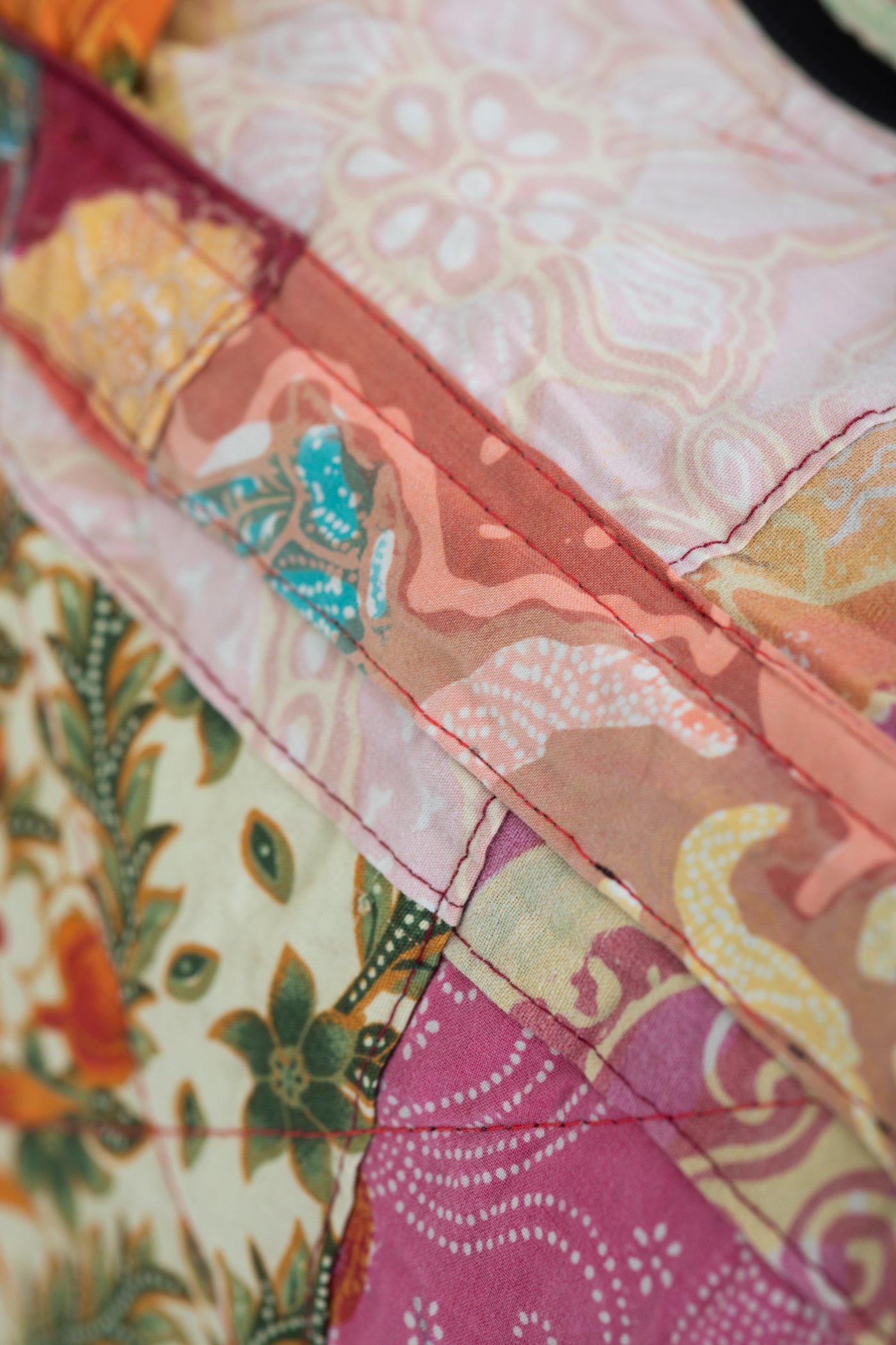 Assorted multicolor patchwork weekend bag detail of sewing