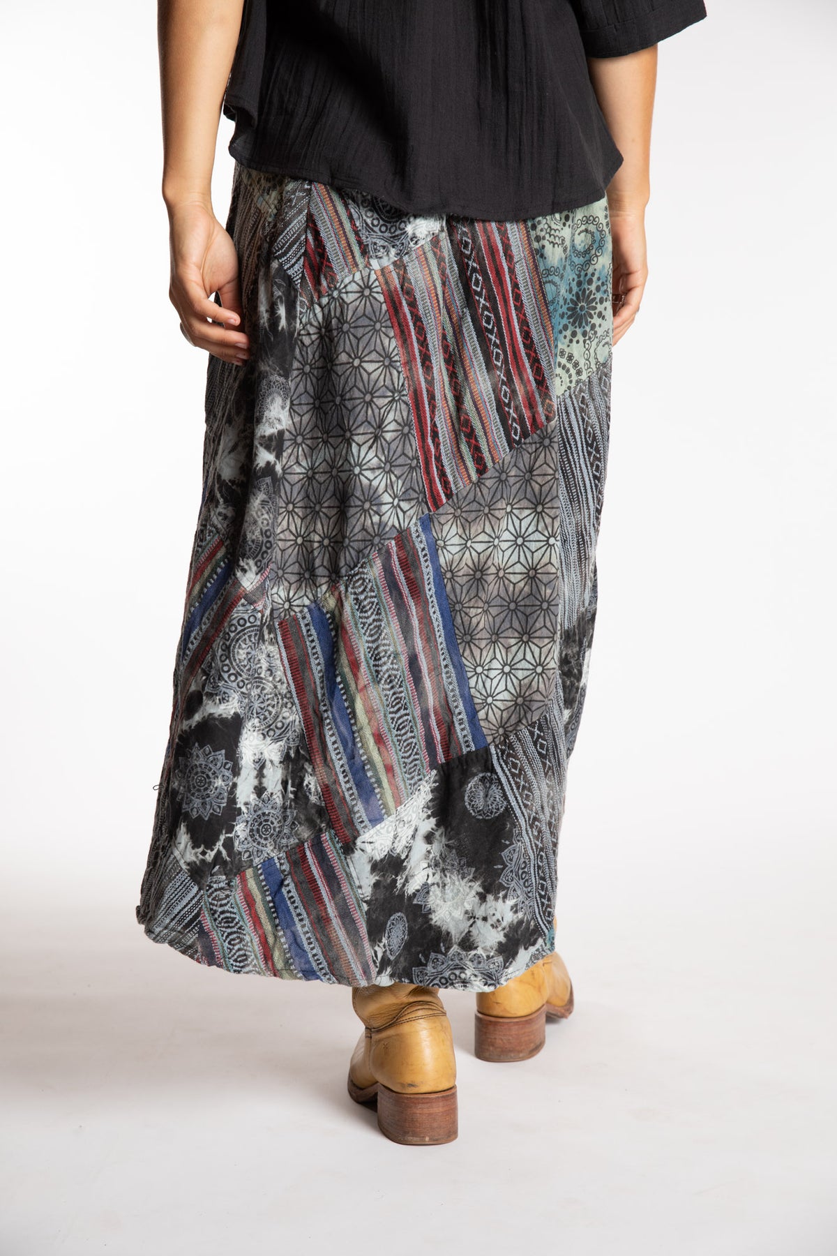 Sophie is wearing the Black Jaya Patchwork Utility Wrap Skirt in S/M