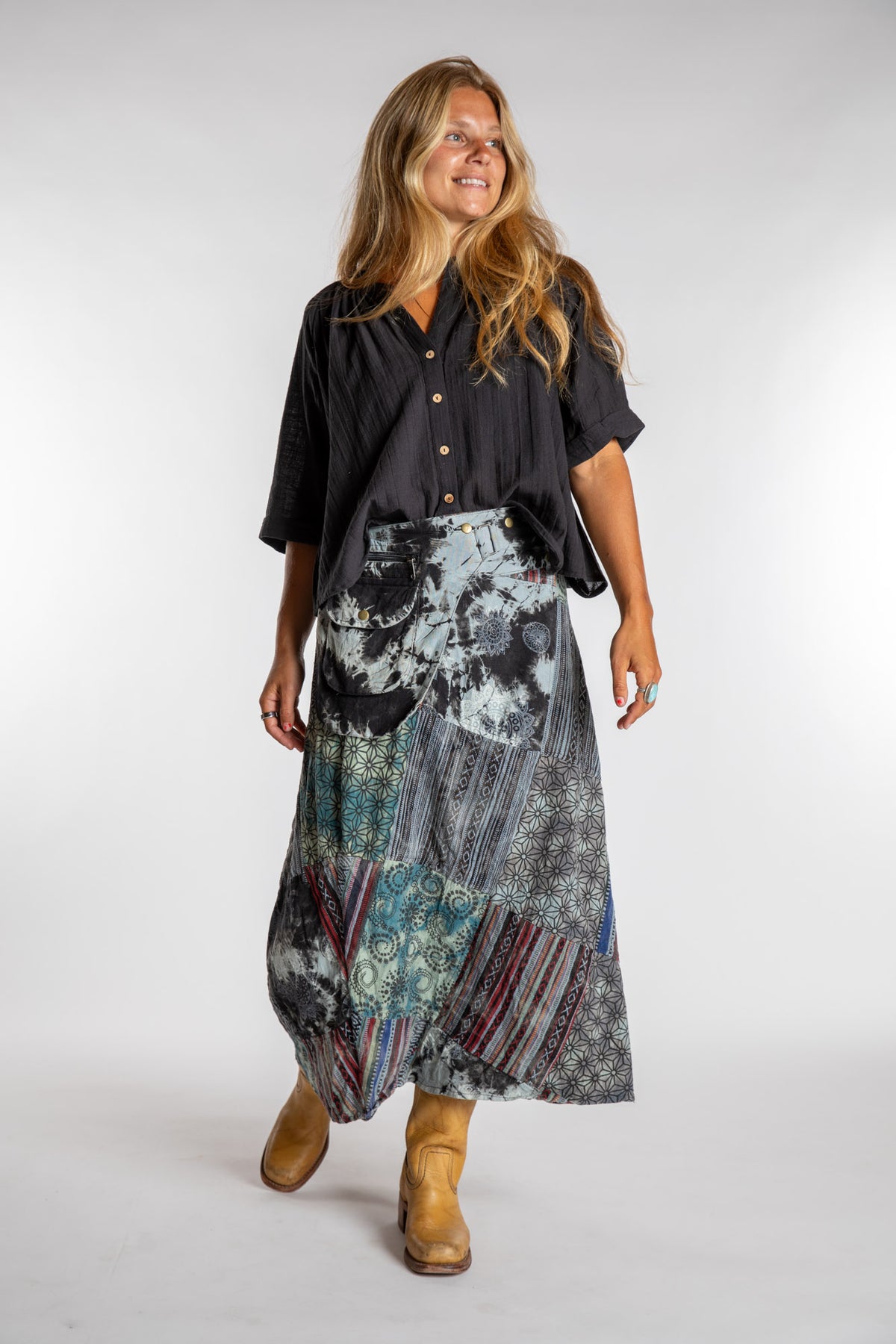 Sophie is wearing the Black Jaya Patchwork Utility Wrap Skirt in S/M