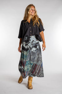 Sophie is wearing the Black Jaya Patchwork Utility Wrap Skirt in S/M