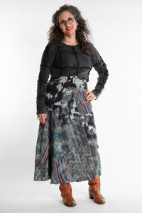 Susan is wearing a S/M Jaya Patchwork Utility Skirt in Black