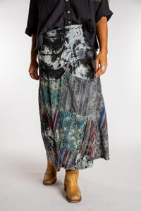 Sophie is wearing the Black Jaya Patchwork Utility Wrap Skirt in S/M