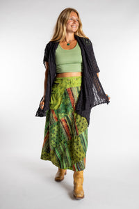 Sophie is wearing the Green Jaya Patchwork Utility Wrap Skirt in S/M