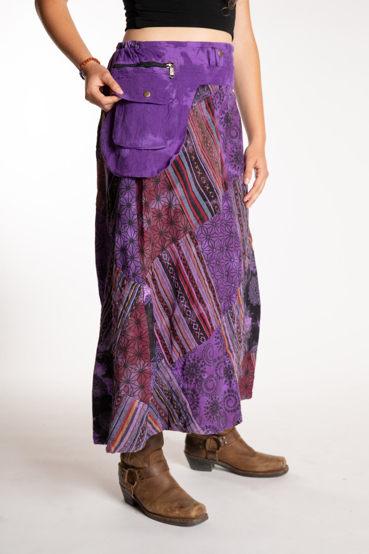Emily is wearing the Purple Jaya Patchwork Utility Wrap Skirt in S/M