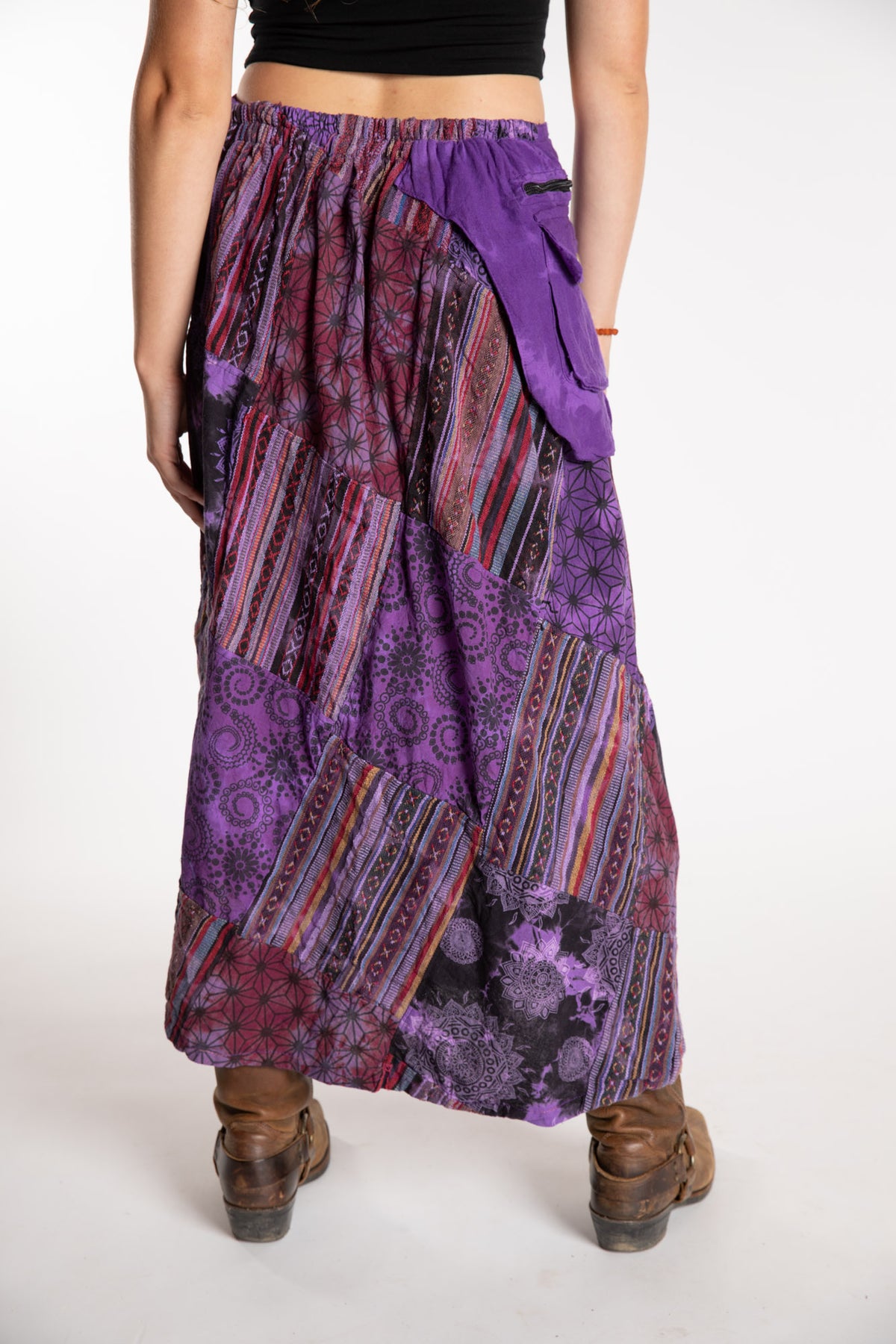 Emily is wearing the Purple Jaya Patchwork Utility Wrap Skirt in S/M