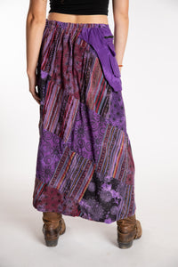 Emily is wearing the Purple Jaya Patchwork Utility Wrap Skirt in S/M