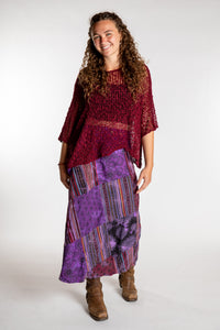 Emily is wearing the Purple Jaya Patchwork Utility Wrap Skirt in S/M