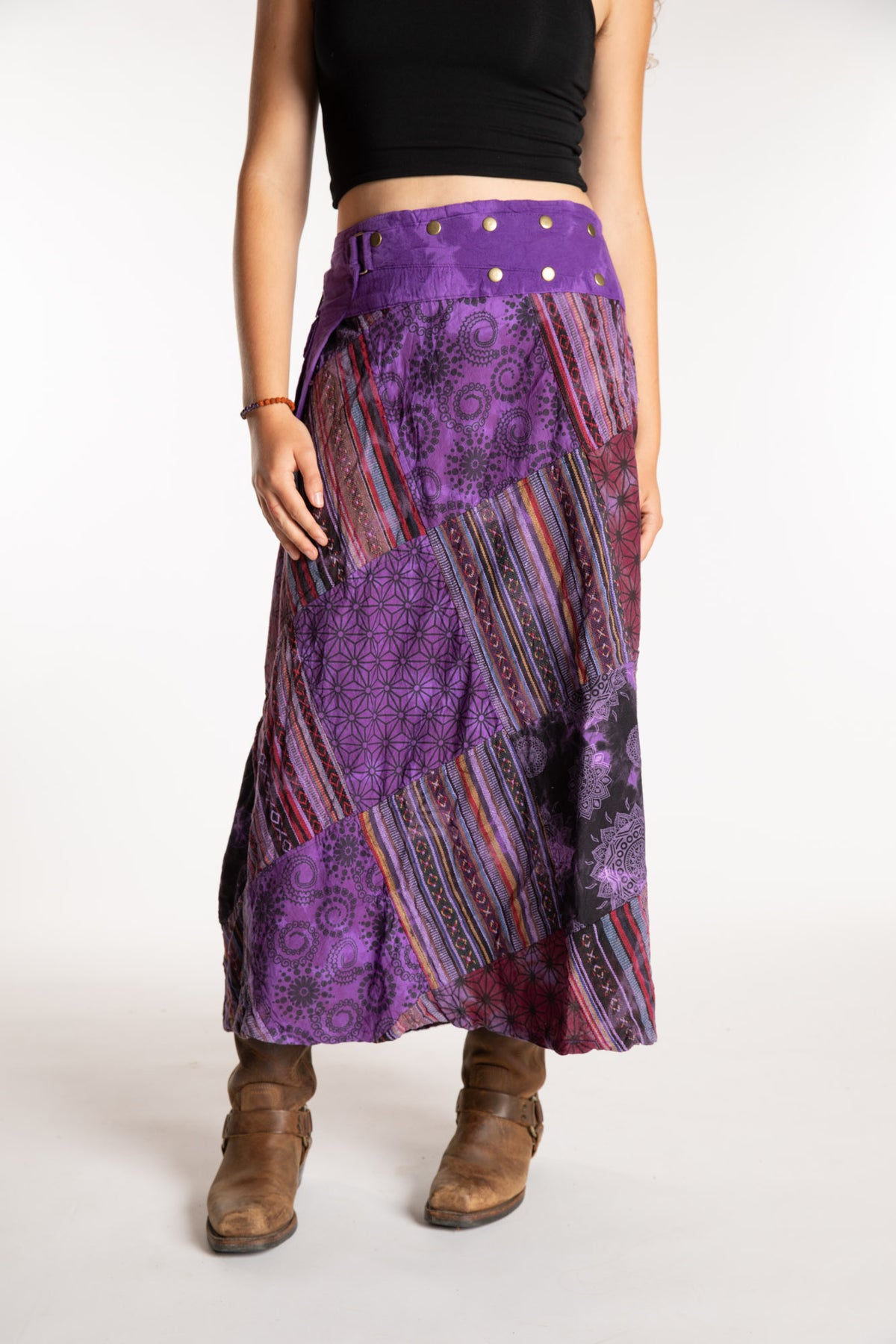 Emily is wearing the Purple Jaya Patchwork Utility Wrap Skirt in S/M