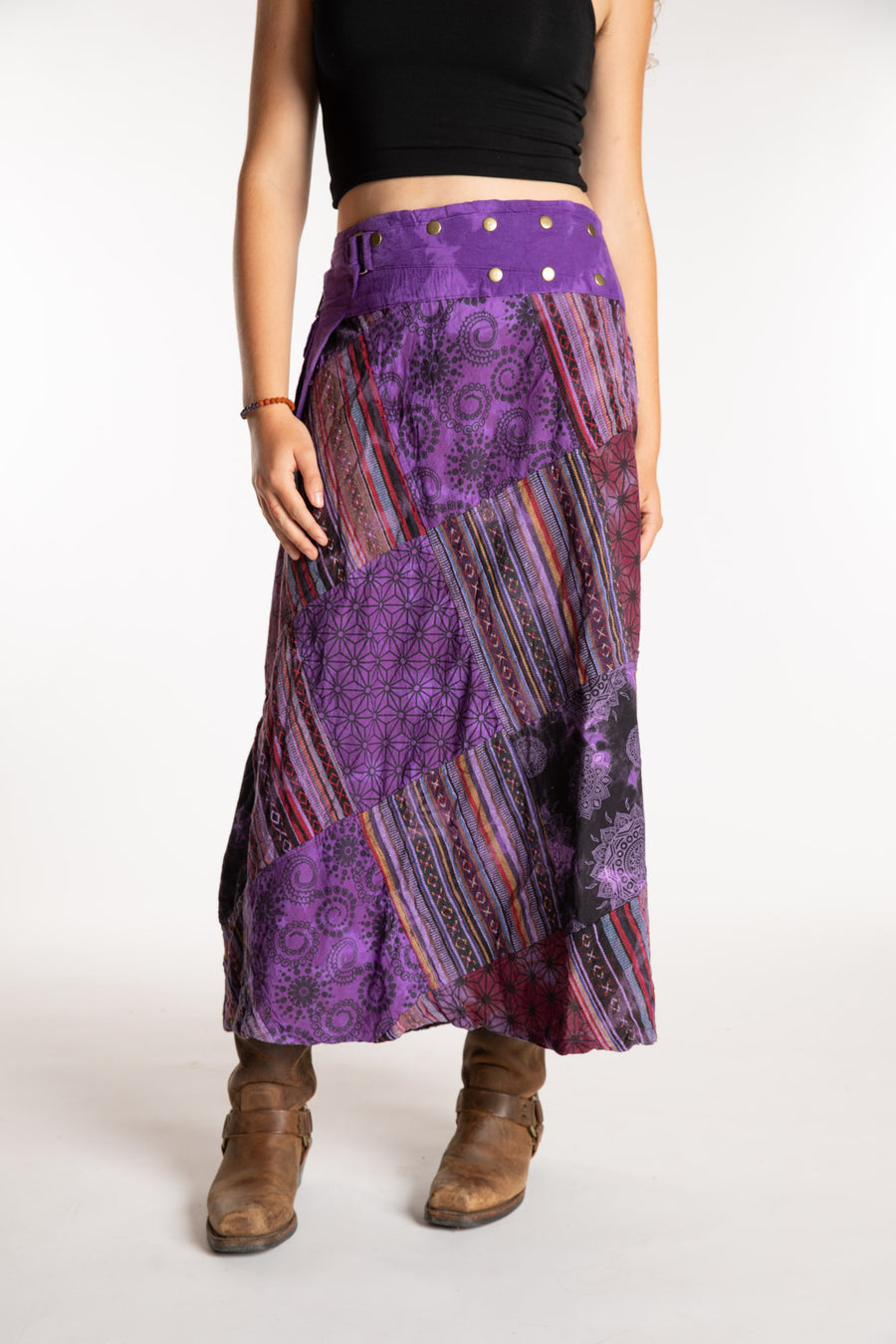 Emily is wearing the Purple Jaya Patchwork Utility Wrap Skirt in S/M