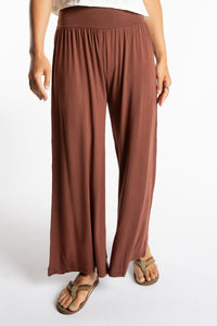 Sophie is wearing S/M Wide Leg Pants in Brown