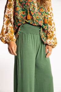 Sophie is wearing S/M Wide Leg Pants in Olive green