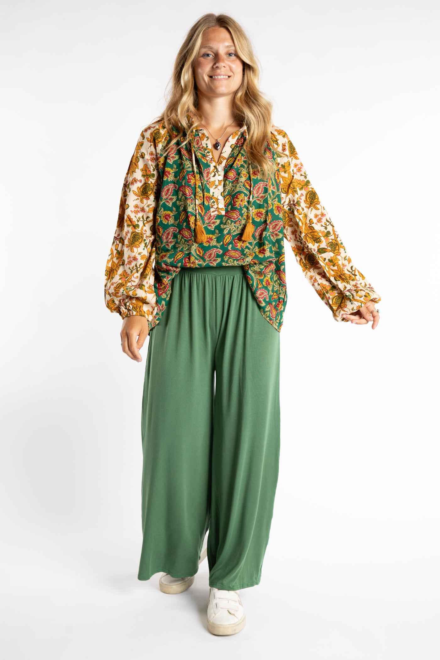 Sophie is wearing S/M Wide Leg Pants in Olive green with poet tunic